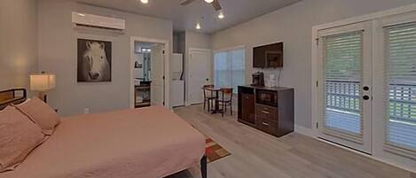 Spacious one room studio condo with king bed, tv, coffee maker, refrigerator and microwave
