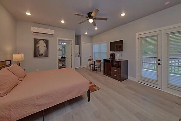Spacious one room studio condo with king bed, tv, coffee maker, refrigerator and microwave