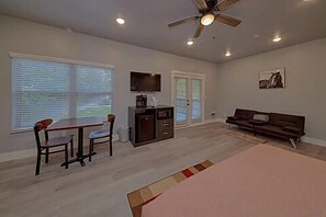 Spacious one room studio condo with king bed, tv, coffee maker, refrigerator and microwave