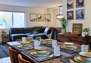 Table for 6 looking on to the living room sectional.