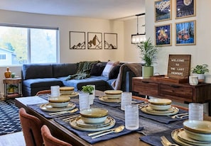 Table for 6 looking on to the living room sectional.