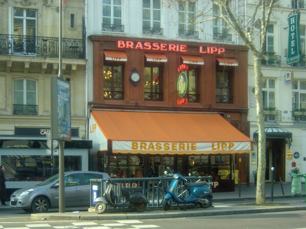 steps to Boulevard Saint Germain, close to Brasserie Deux Magots and Cafe Flore