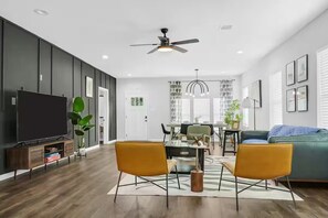 Living Room with Sofas, chairs and dining table