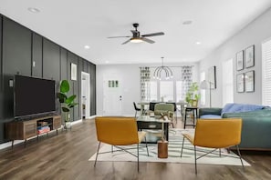 Living Room with Sofas, chairs and dining table
