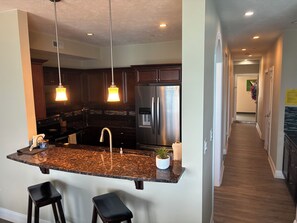 Additional seating at counter. Stainless steel kitchen--both keurig & Mr. Coffee