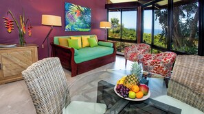 Living and dining areas with ocean and jungle views