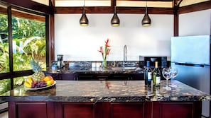 Full kitchen with cooktop, microwave, and refrigerator/freezer