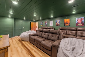 Private theater room with comfortable seating and big-screen entertainment.
