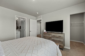 Primary bedroom queen bed and ensuite full bathroom