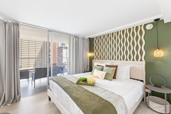 Modern bedroom with balcony access and artistic accent wall