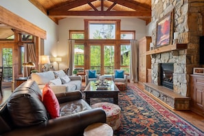 Large windows and vaulted ceilings brighten the space