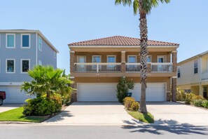 The townhome is located on the left side.