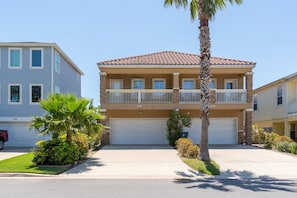 The townhome is located on the left side.