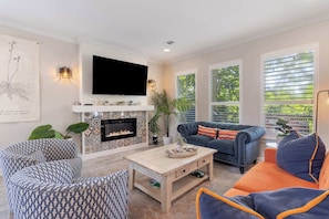 Living room: Main floor, Smart TV (55”), Roku, central heat and A/C, open layout