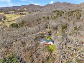 Soaring above High Meadow Manor, take in the sweeping mountain vistas that surround this beautiful retreat.