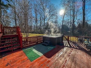 Soak up the sun and the serenity—this hot tub by the deck is the ultimate daytime retreat.