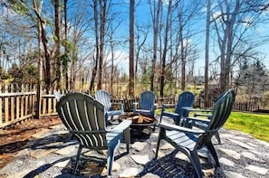 End your day with crackling flames and great company—this firepit is the perfect place to unwind.
