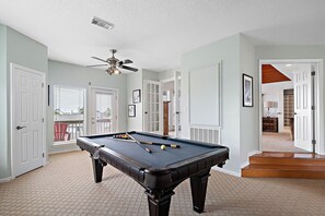 Enjoy this game room with a variety of games