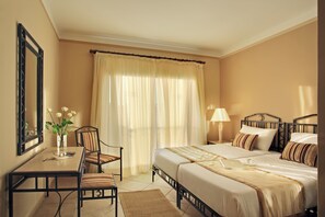 Unit with 2 Twin beds. Exact unit will be assigned upon arrival. Views, colors, and decor may vary.