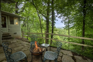 Rustic rock pavers at firepit gathering area and mountain skyline view