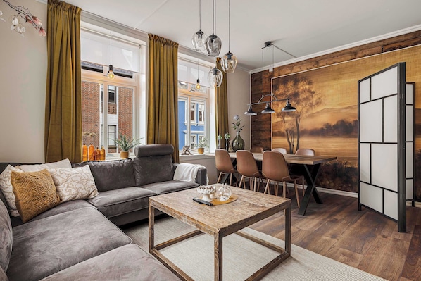Enjoy a combined space for meals and relaxation, filled with sunlight.