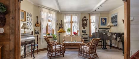Restored living room with antique furniture and artwork