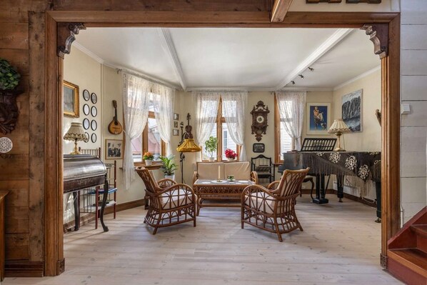 Restored living room with antique furniture and artwork