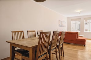 Dining area featuring a large table and seating for six, perfect for shared meals and conversations.