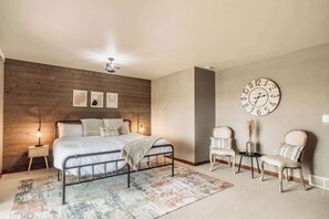 Relax in the king master suite with ultra-comfy mattress, 50" Smart TV, and stunning river views. Patio doors open to the deck for peaceful morning coffee or evening sunsets—your perfect private retreat.