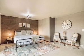 Relax in the king master suite with ultra-comfy mattress, 50" Smart TV, and stunning river views. Patio doors open to the deck for peaceful morning coffee or evening sunsets—your perfect private retreat.
