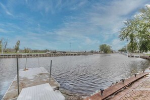 Breathtaking views await from the private dock—watch the sun dip toward the Bay of Green Bay as you soak in peaceful waterfront serenity. Perfect for morning coffee, evening unwinding, or launching your next boating adventure.