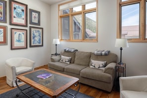 Spacious living room with high ceilings and views to the west