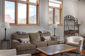 Spacious living room with high ceilings and views to the west