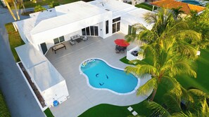 Tropical escape with a private pool and sunny outdoor space.