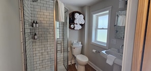 Private bathroom with fresh linens and thoughtful touches.