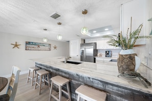 Open updated kitchen with gorgeous countertops!