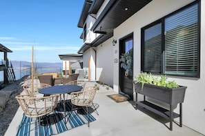 Outdoor patio has spectacular Lakeview, dining table and loungers
