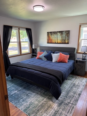 King bed with mounted TV