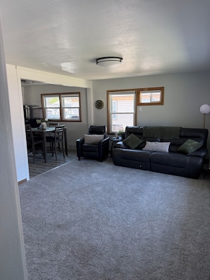 Large living room with bright large windows