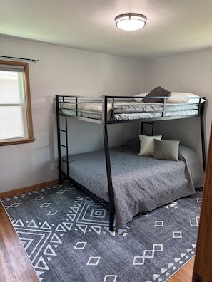 Queen and full size bunk beds with TV mounted