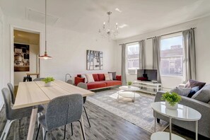 Enjoy a meal at the table, then relax on the cozy sofas.