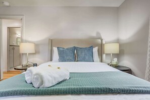 Comfortable second bedroom featuring soft lighting, fresh linens, and a calming color palette for a peaceful stay.

