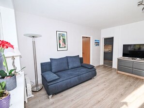 Furniture, Flooring, Interior Design, Floor, Wood, Room, Couch, Living Room, Wood Flooring, Table