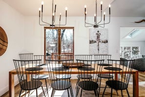 Modern table with seating for 8 plus highchair and bonus bar seating.