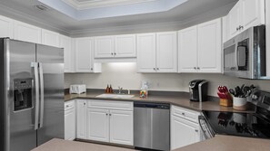 Prep snacks, build sandwiches, and prepare your feast without bumping elbows in this spacious kitchen! 