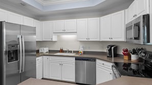 Prep snacks, build sandwiches, and prepare your feast without bumping elbows in this spacious kitchen!