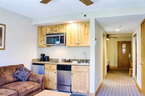 Kitchenette and hall to Bathroom and Sleeping space | Listed with @BookTraverse