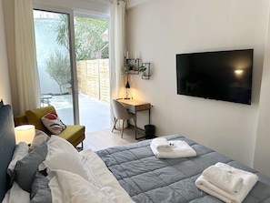 Cozy bedroom with double bed and smart TV