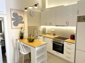 Fully-equipped kitchen with dining setup
