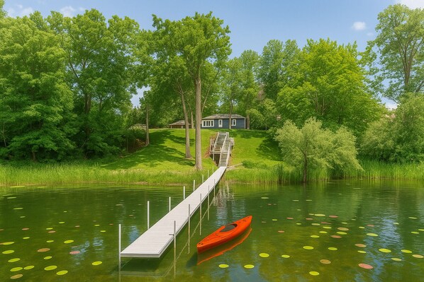 Private dock leads right to your lakeside retreat—seamless access for paddling, relaxing, or soaking in the view.